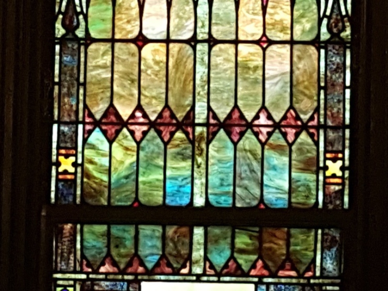 Stained glass window with number 12